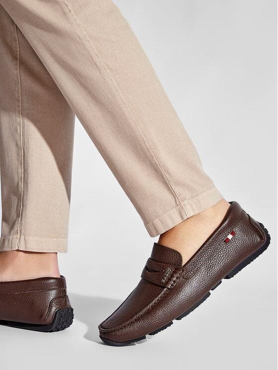 Model wearing brown Bally driving shoes with cropped trousers.