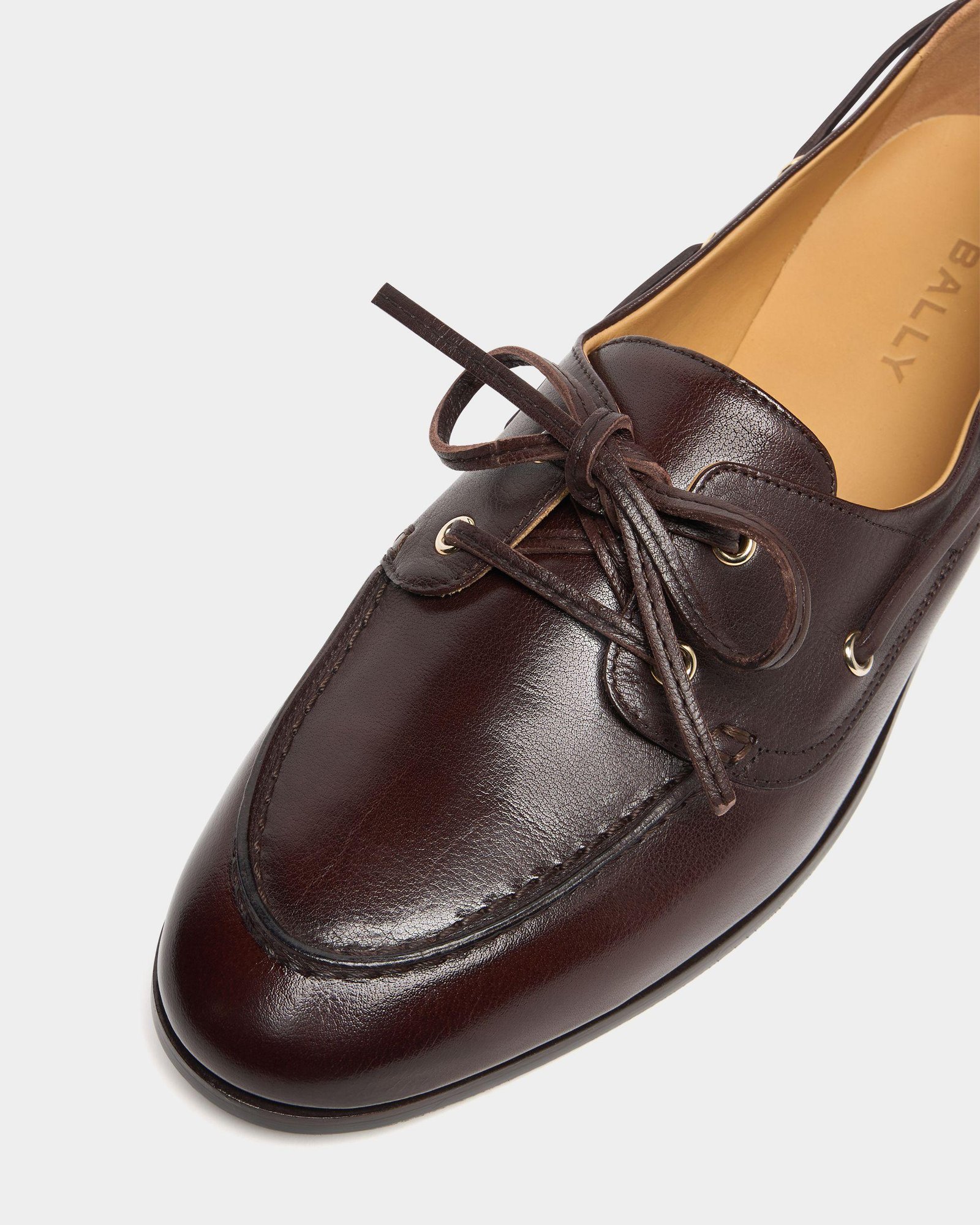 Close-up of brown Bally leather shoes showing stitching and construction.