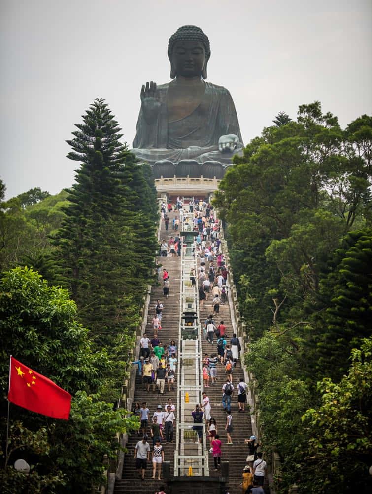 Visitors approaching Tian Tan Buddha during the morning.
