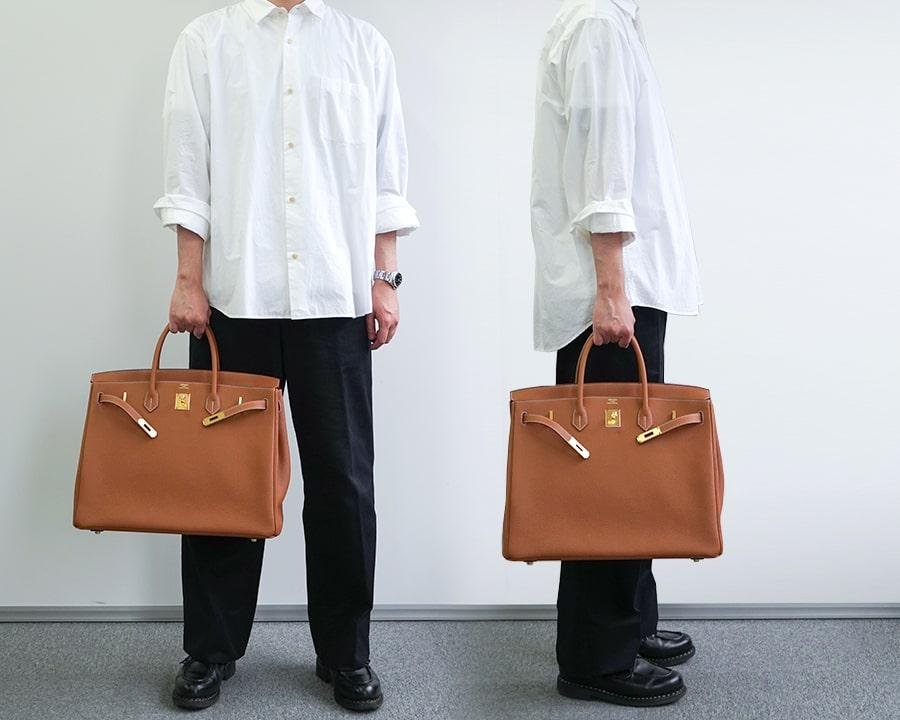 Models carrying Hermès Birkin bags by hand.