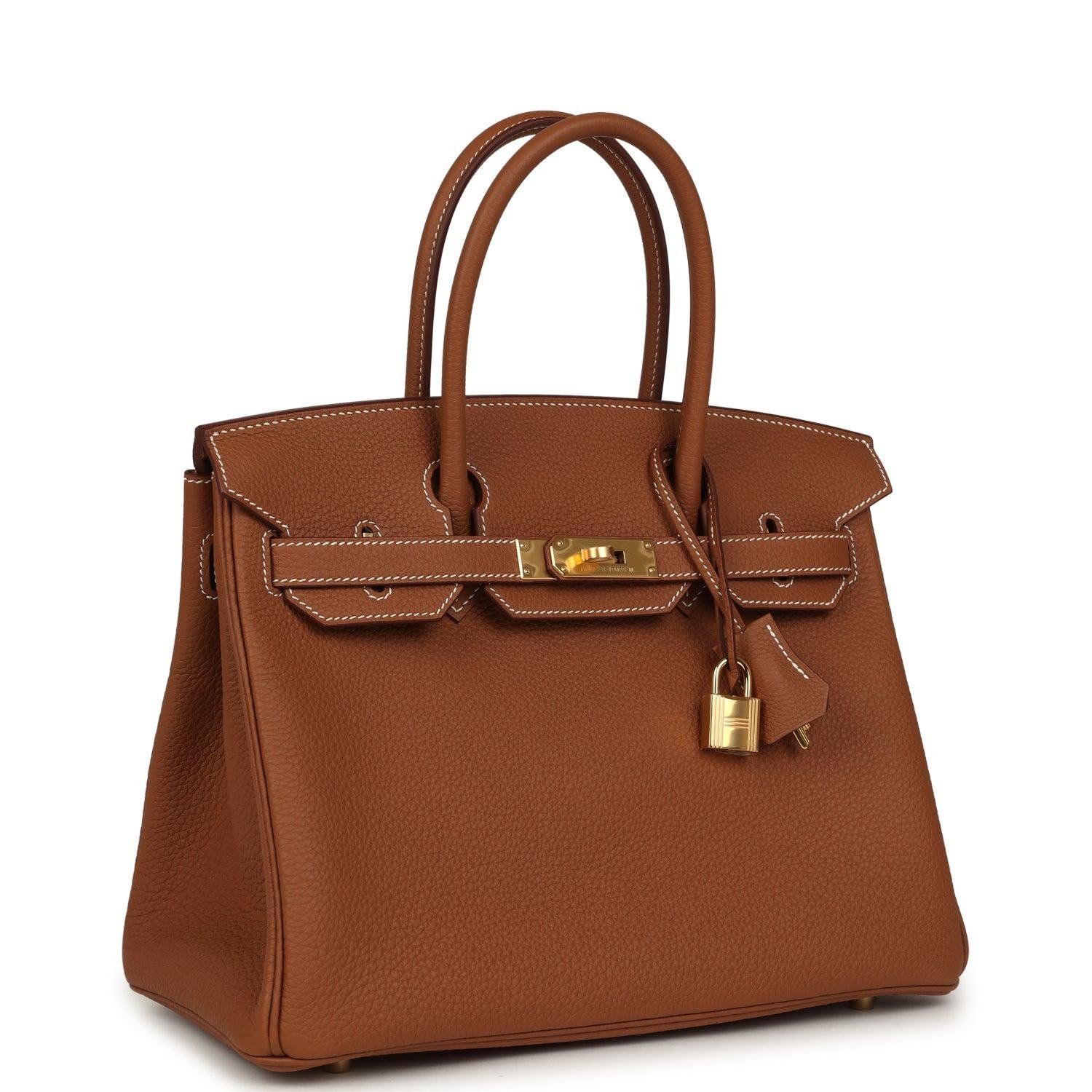 Gold leather Hermès Birkin photographed against a clean background.
