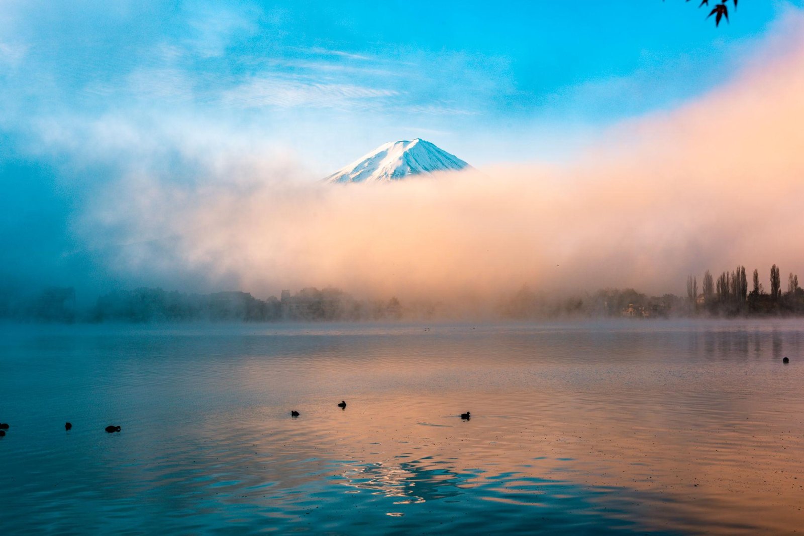 Mount Fuji partially hidden behind clouds near Lake Kawaguchiko