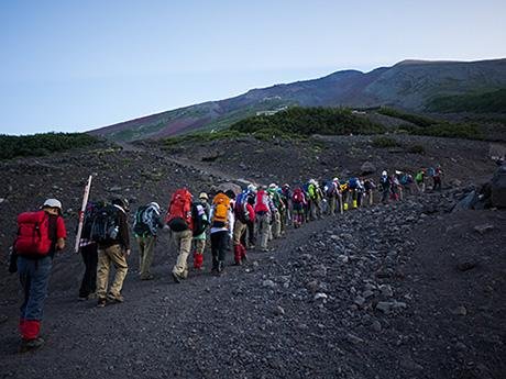 Hikers ascending Mount Fuji during the official climbing season