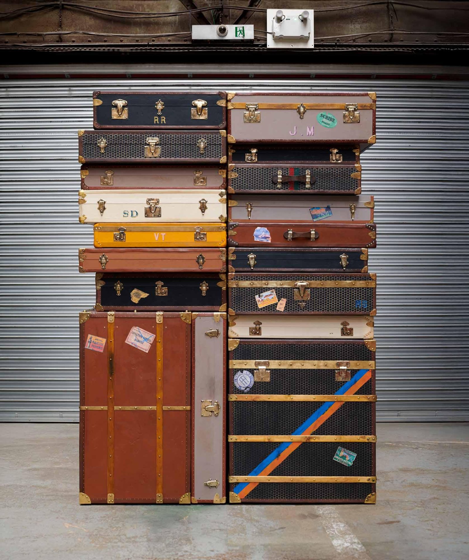 Historic Moynat travel trunks showing curved construction and hand-finished details.