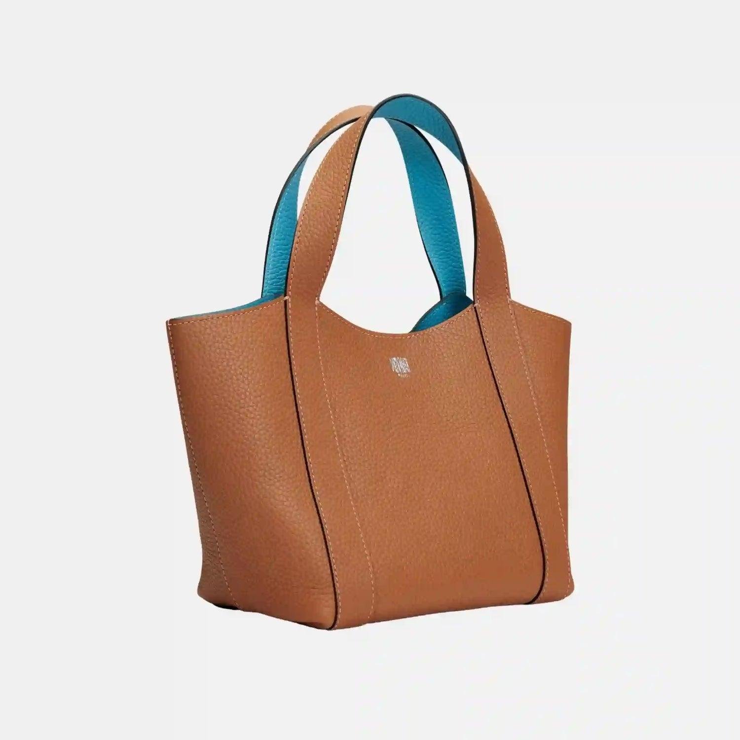 Two-tone Moynat Duo BB leather tote with slim handles and open shape.