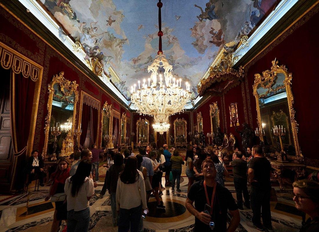 Visitors touring the state rooms of the Royal Palace of Madrid