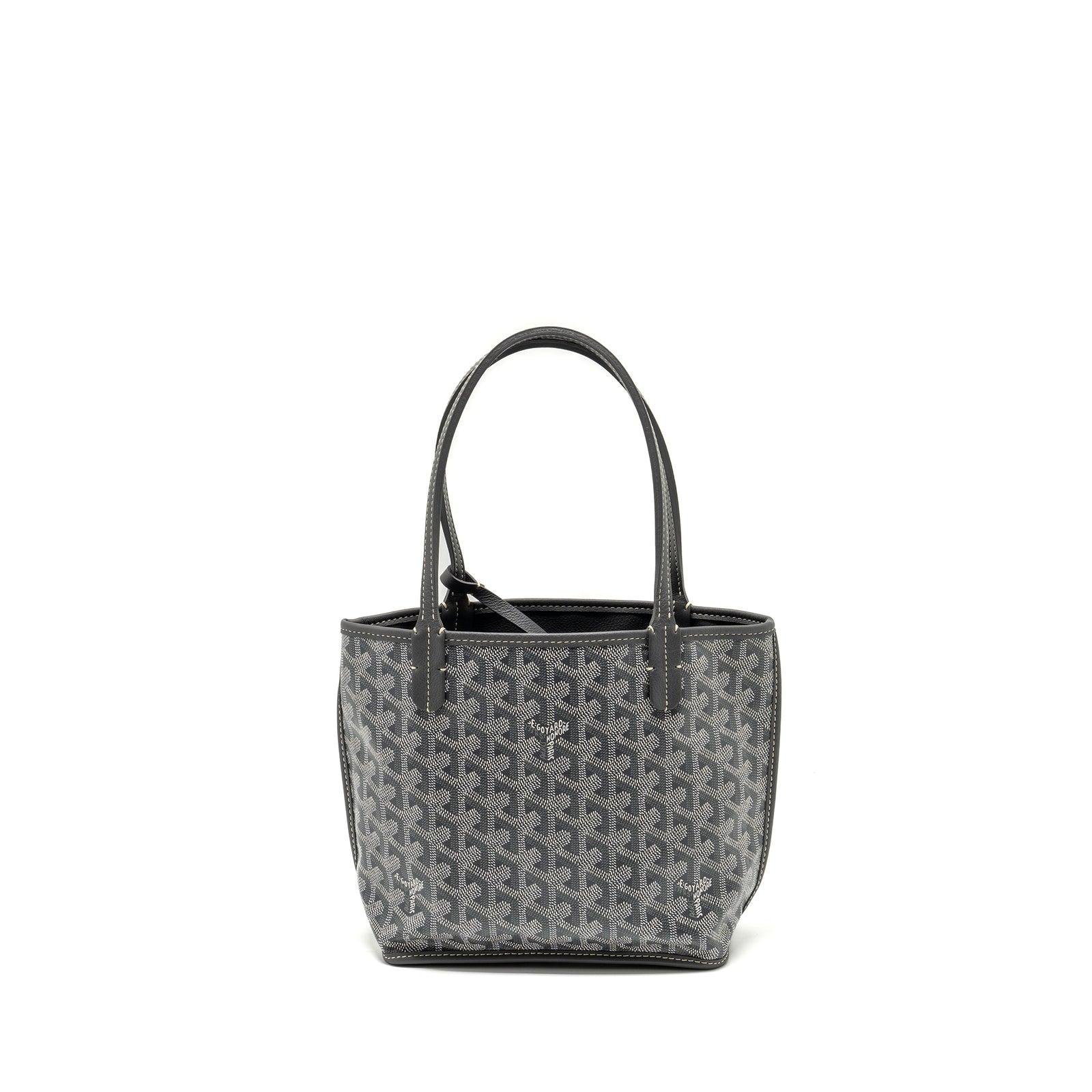 Grey Goyard tote displaying the house’s signature Goyardine canvas.