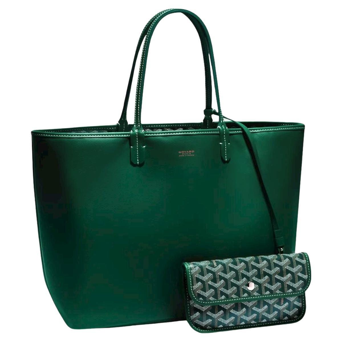 Reversible green Goyard Anjou leather tote with a matching Goyardine canvas pouch.