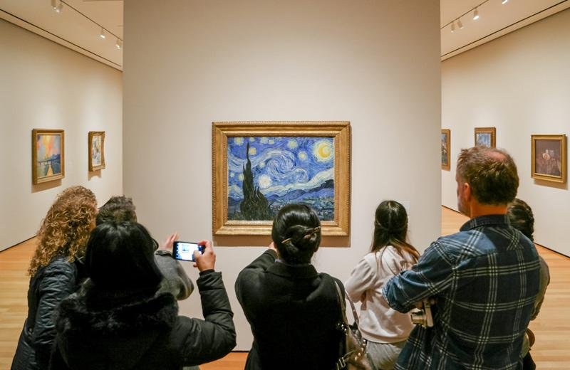 Visitors viewing Vincent van Gogh’s The Starry Night at MoMA