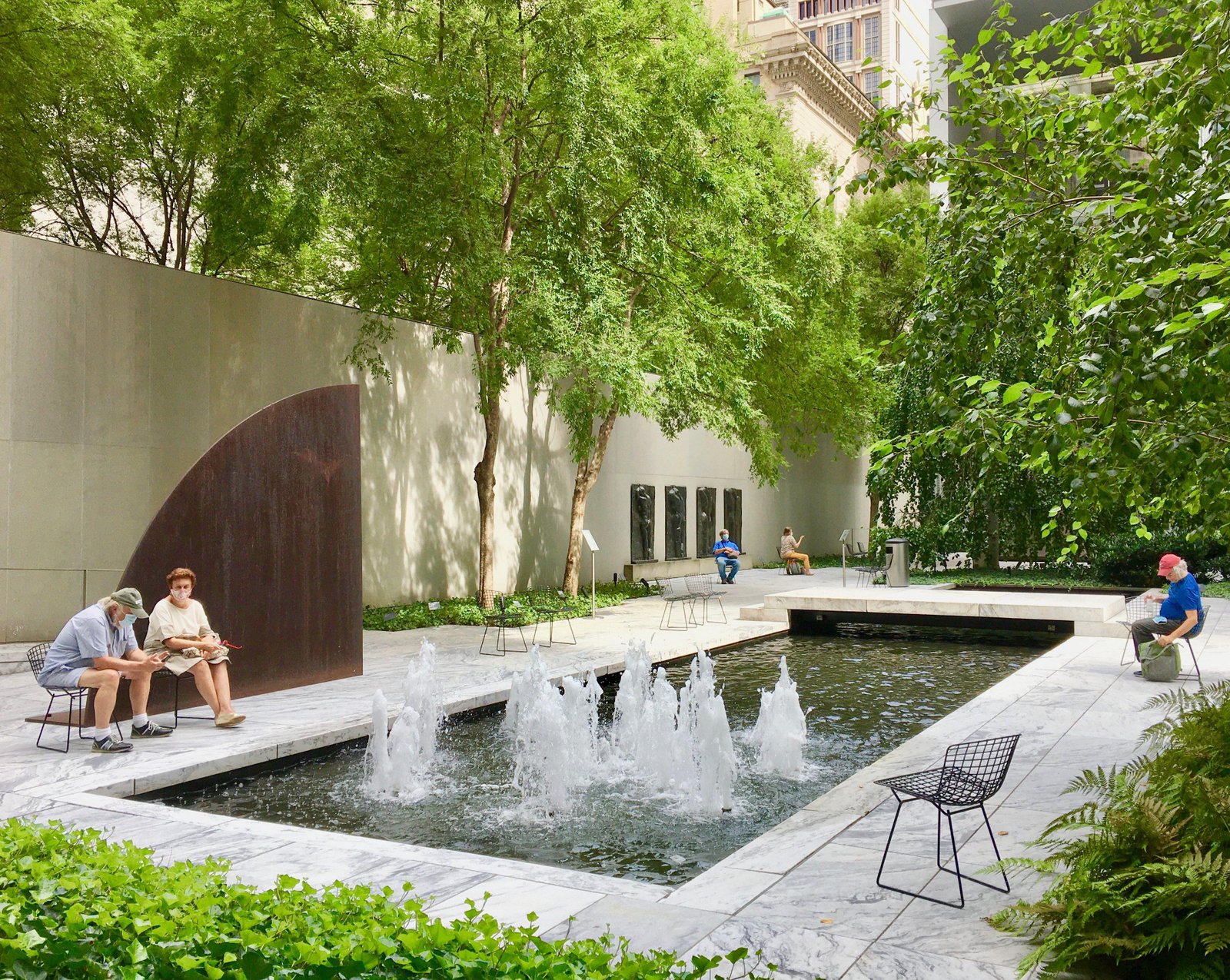 Sculptures, trees and reflecting pool in the MoMA Sculpture Garden