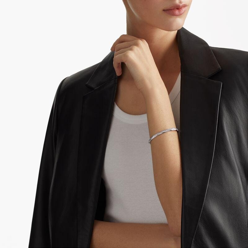Model wearing a Laurence Graff Signature diamond bangle.