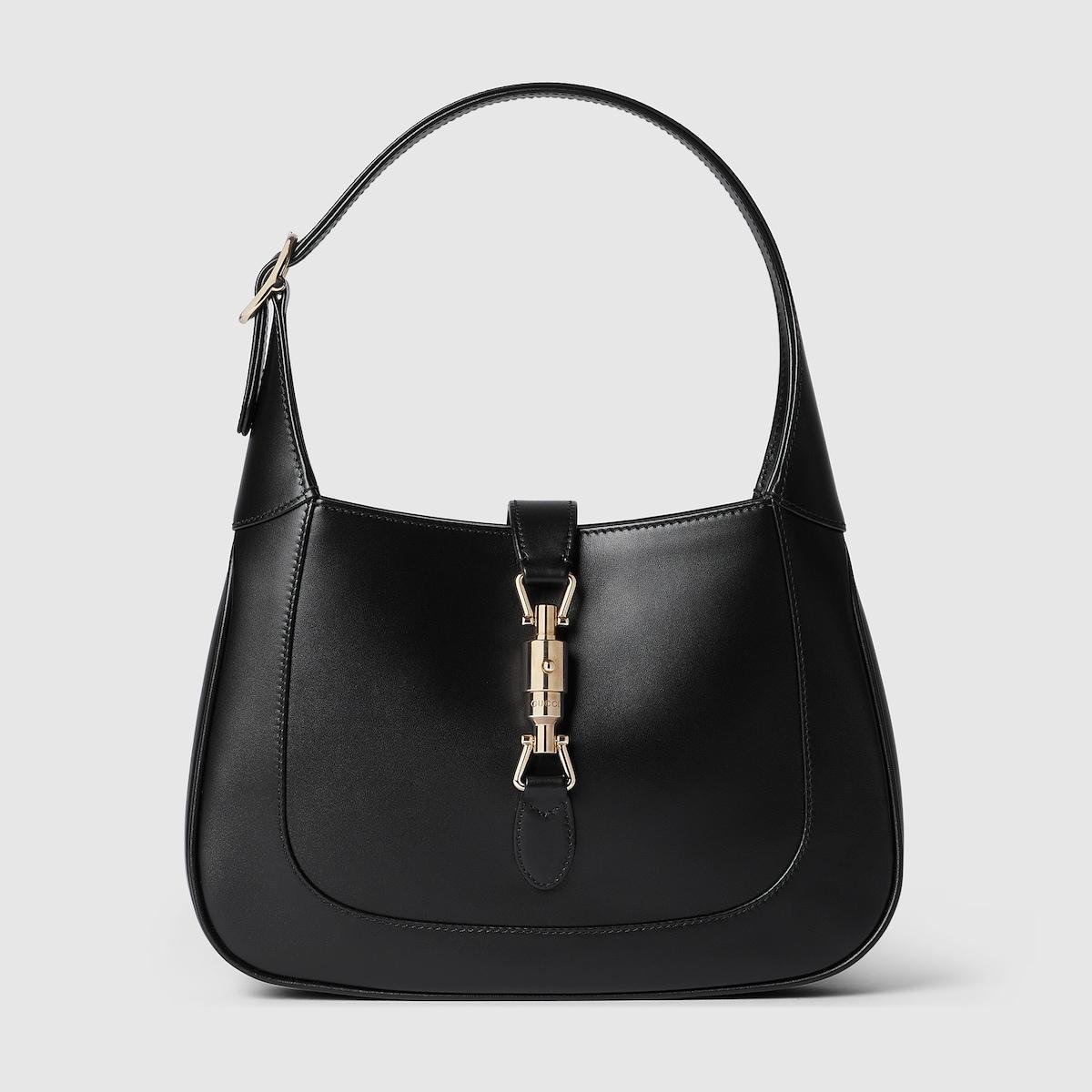 Black leather Gucci Jackie 1961 medium bag on a clean background.