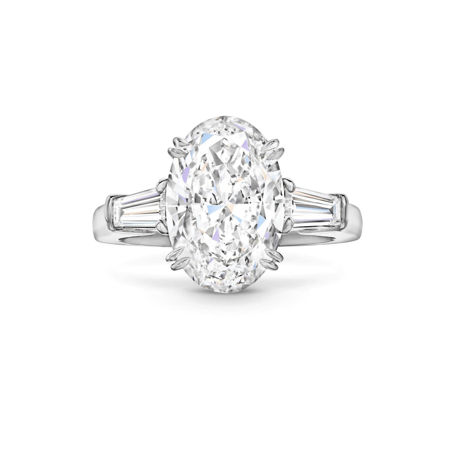 Harry Winston oval diamond engagement ring with side stones.