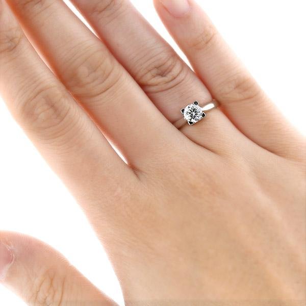 Harry Winston engagement ring worn on the hand.