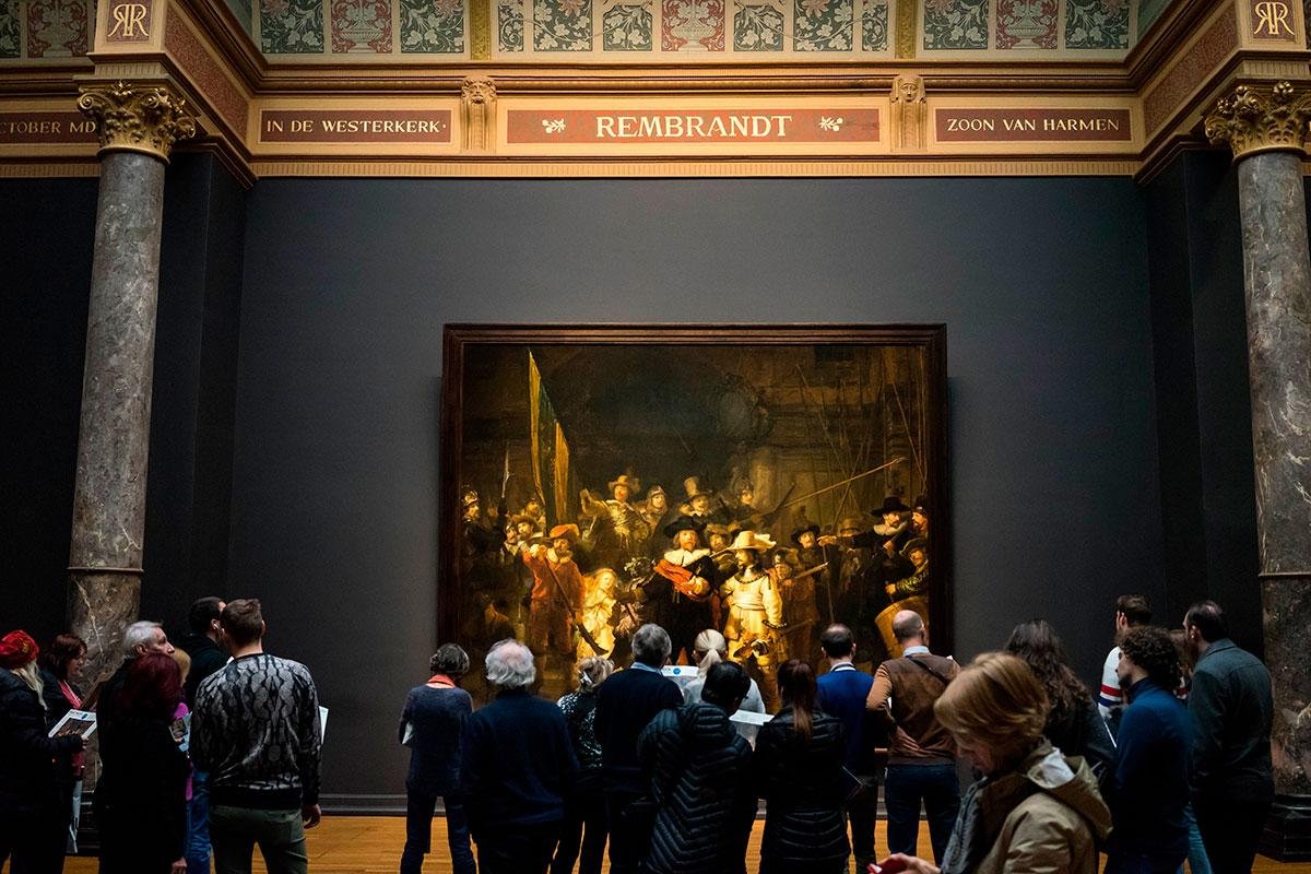 Visitors viewing Rembrandt’s The Night Watch at the Rijksmuseum.