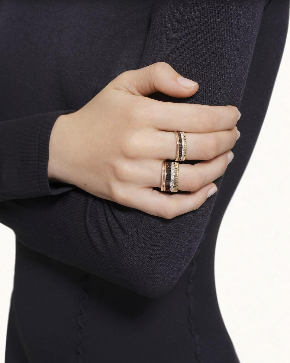 Boucheron Quatre rings worn with a tailored black outfit.