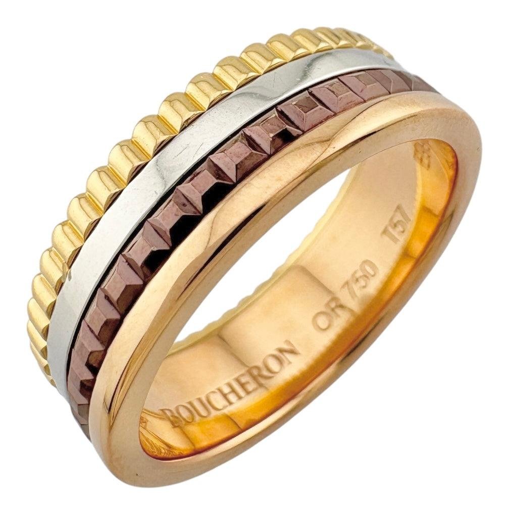 Boucheron Quatre Classique mixed-metal ring on a clean background.