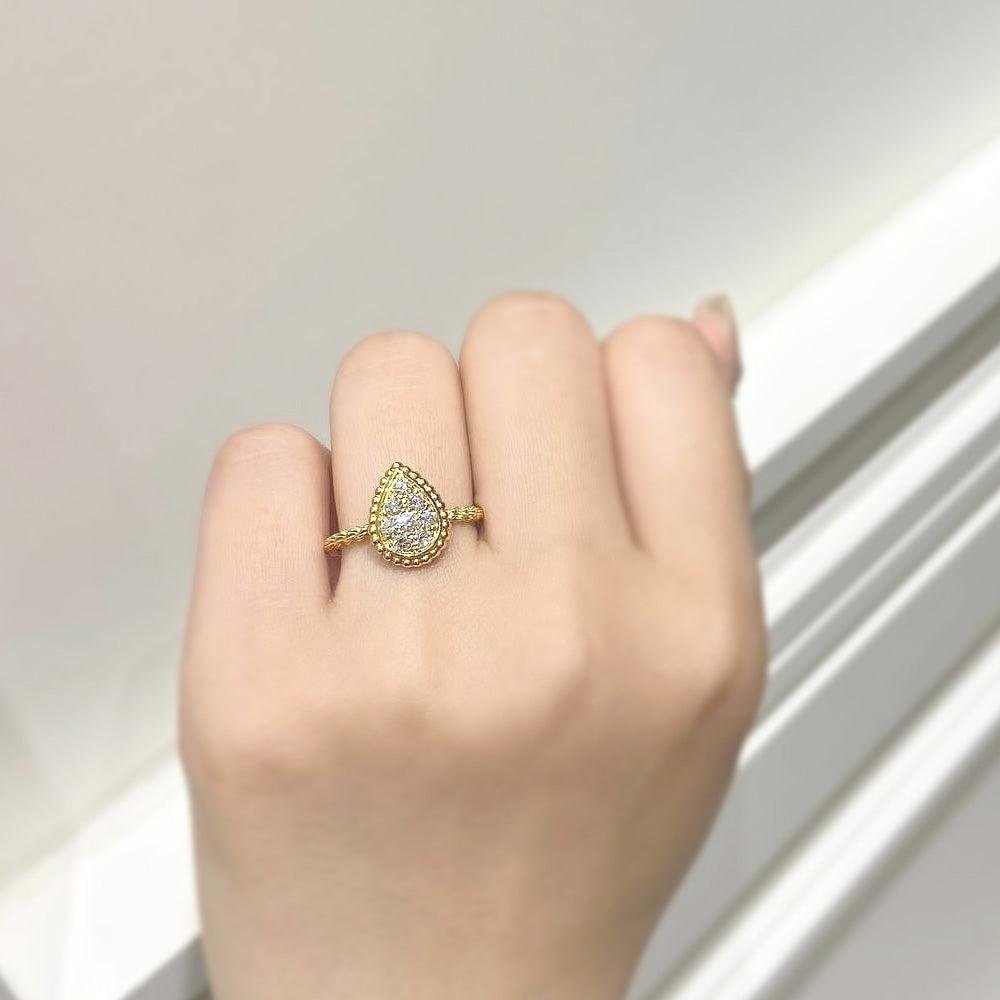 Boucheron Serpent Bohème diamond ring worn on the hand.