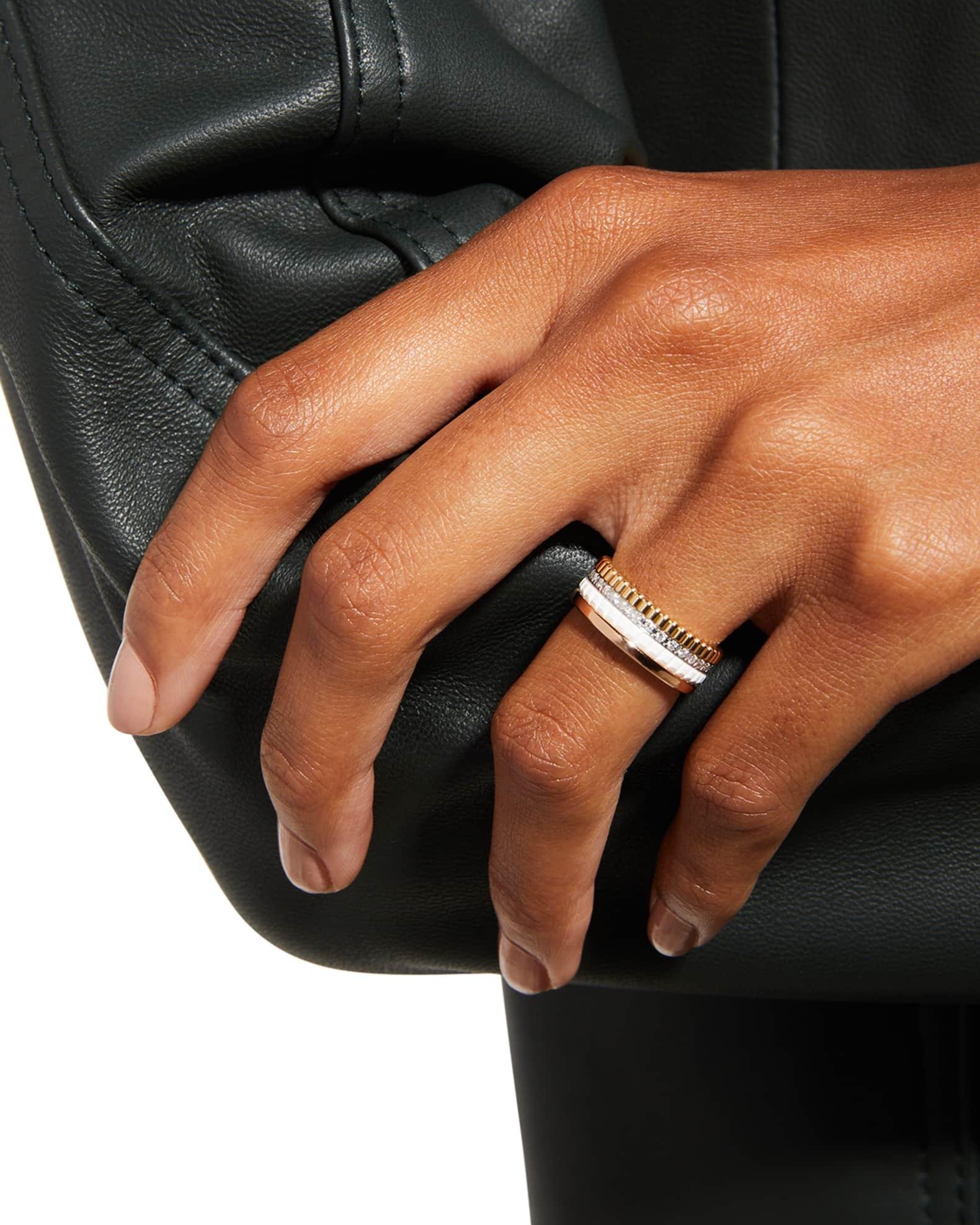 Boucheron Quatre ring worn against black leather.