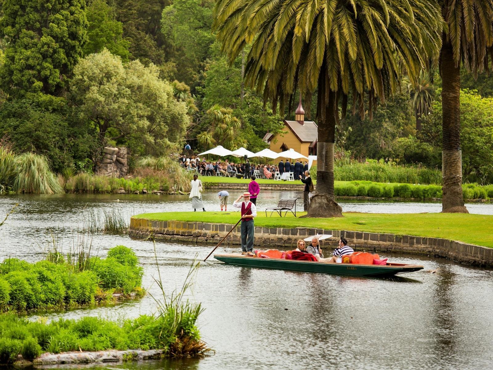 A punt crossing the Ornamental Lake at Melbourne Gardens.