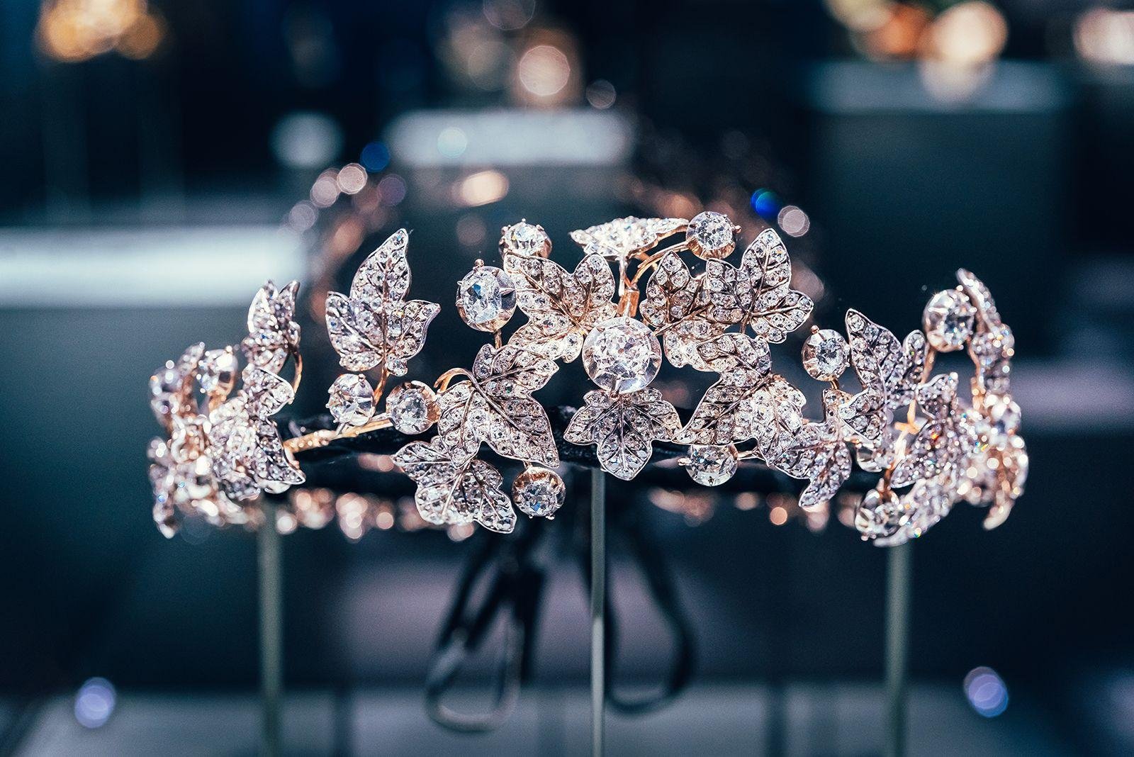 Historic Chaumet tiara displayed against a dark background.