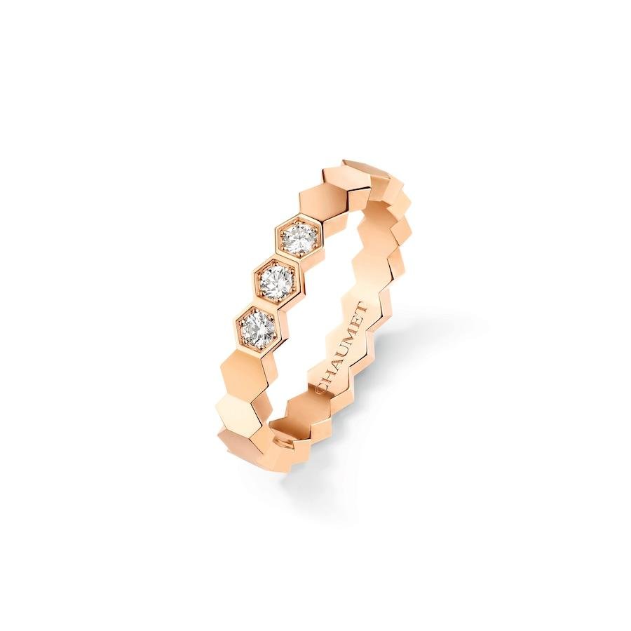 Bee de Chaumet rose-gold ring with diamond honeycomb facets.
