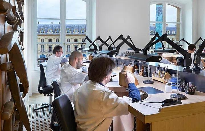 Jewellers working inside a Chaumet workshop.
