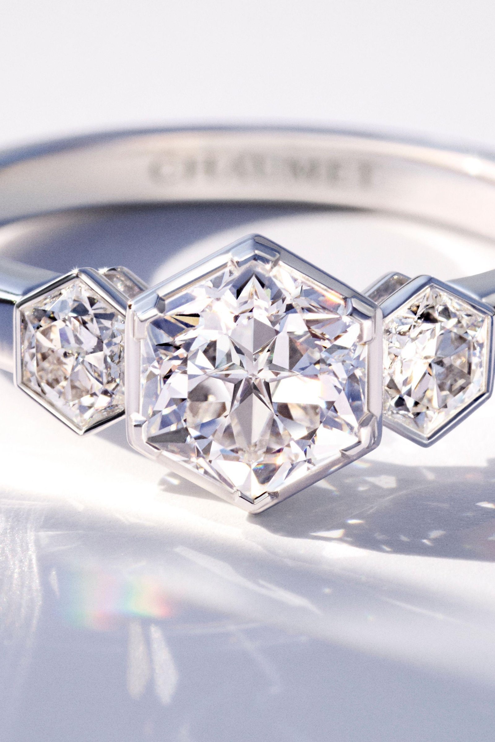 Close-up of diamonds and polished metal on a Chaumet ring.