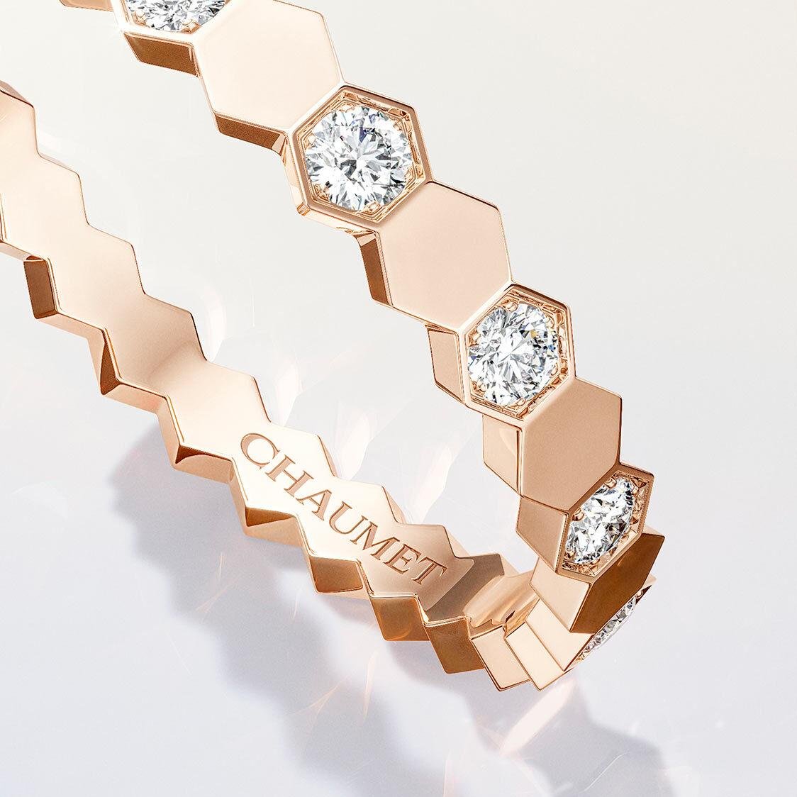 Close-up of Bee de Chaumet rose-gold honeycomb facets and diamonds.