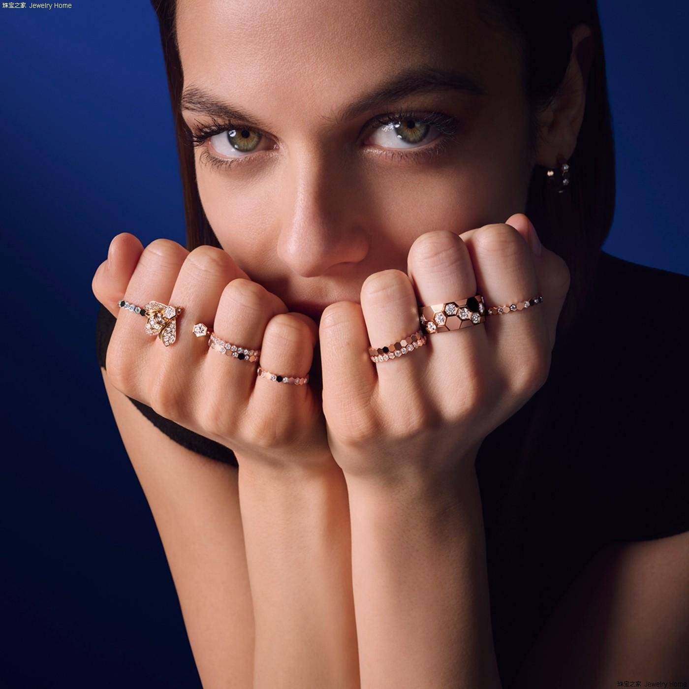 Model wearing a coordinated selection of Chaumet rings.