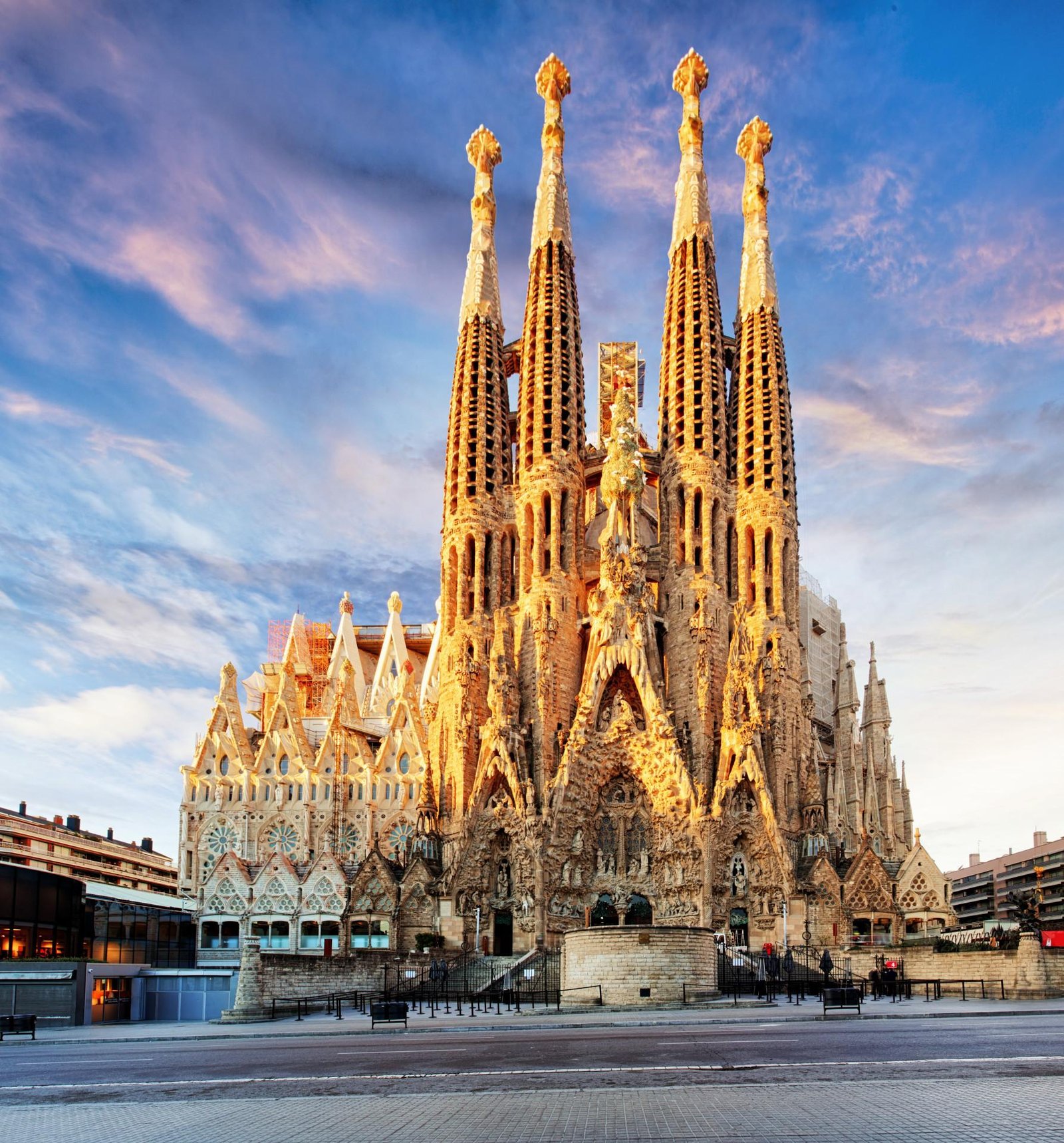 Basilica of the Sagrada Familia exterior in Barcelona at golden hour.