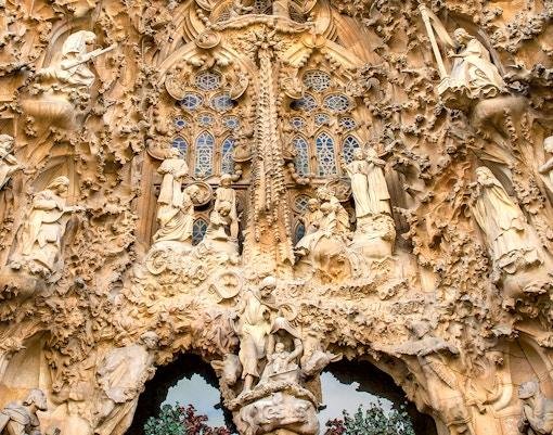 Detailed stone carvings on the Nativity Facade of the Sagrada Familia