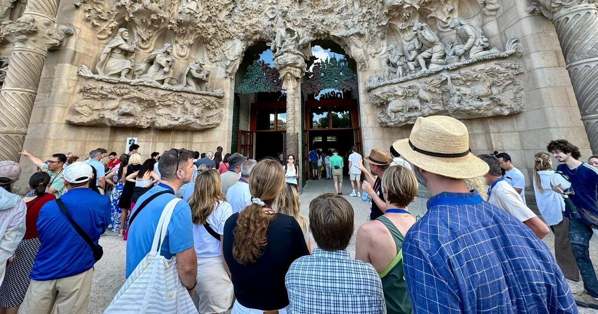 Visitors gathering near the entrance of the Sagrada Familia
