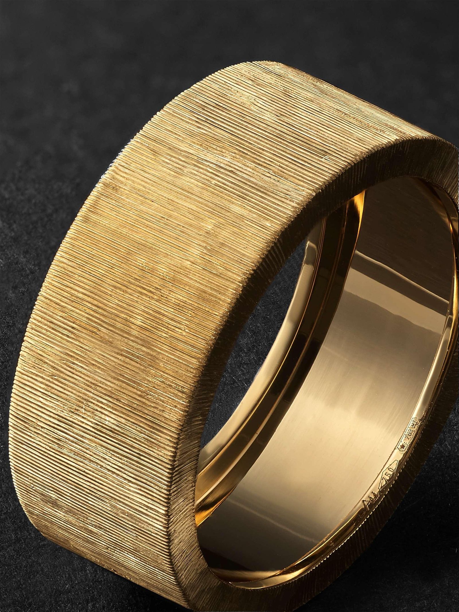Close-up details of Buccellati engraving, openwork gold and diamond settings