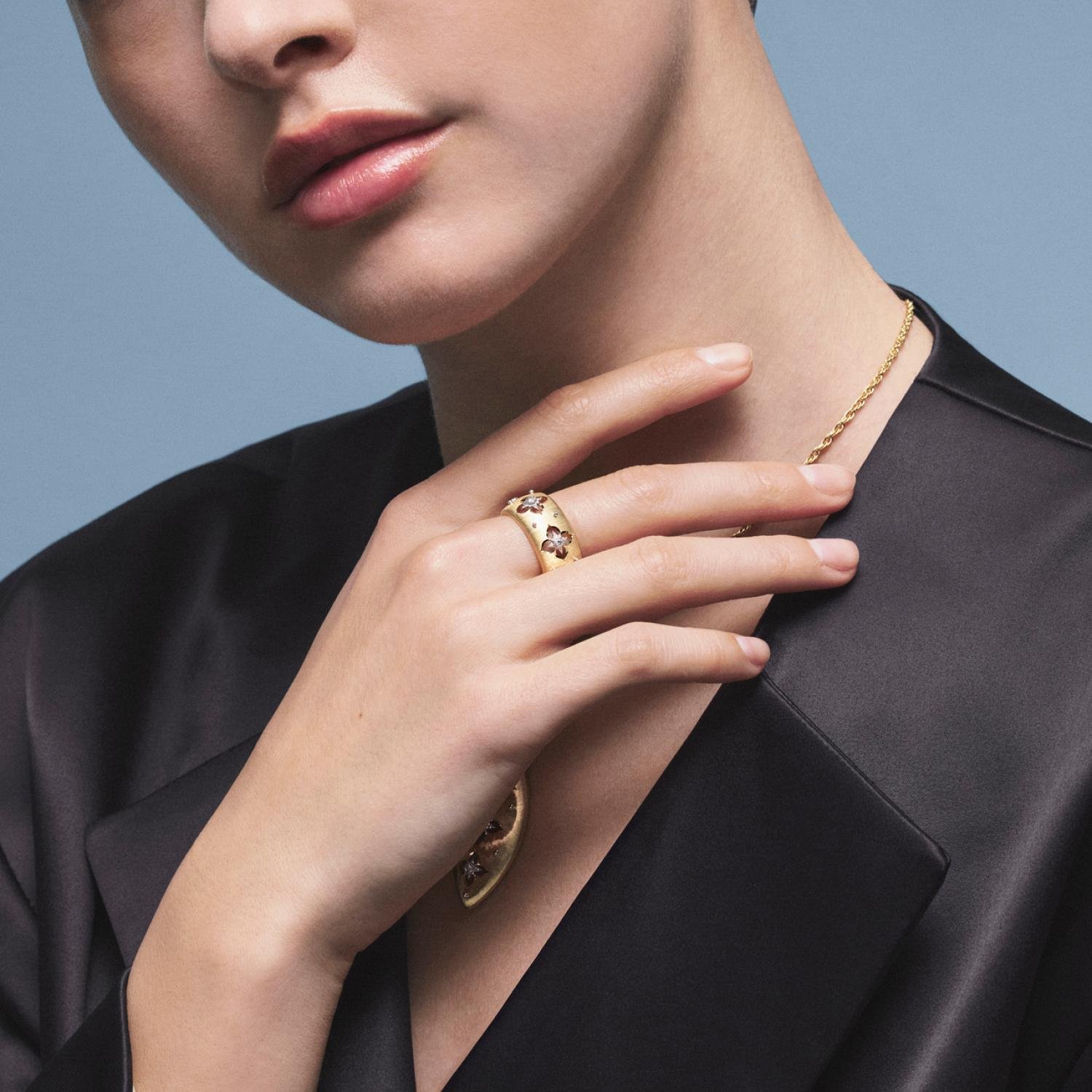Buccellati rings styled on the hand with refined clothing