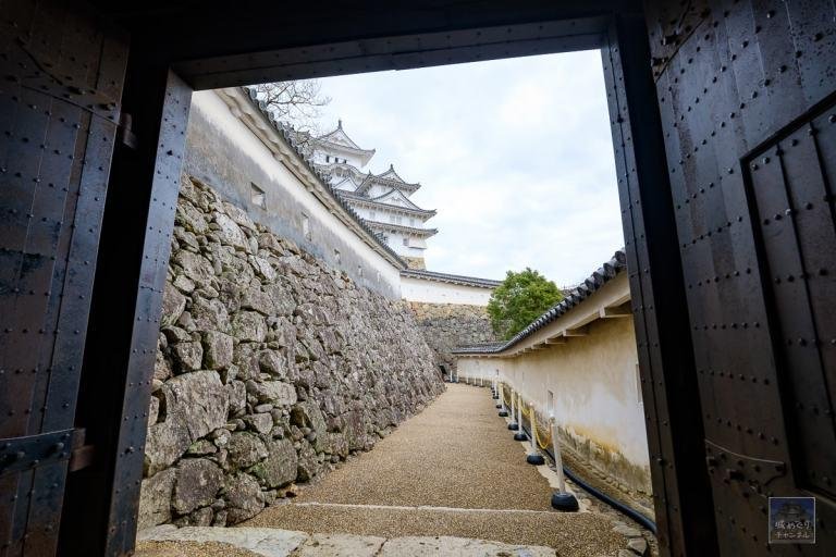 Defensive gates and narrow pathways leading through Himeji Castle.