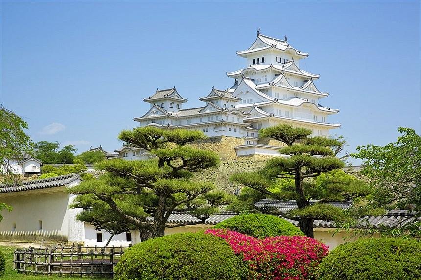 Himeji Castle’s white main keep viewed from its grounds.