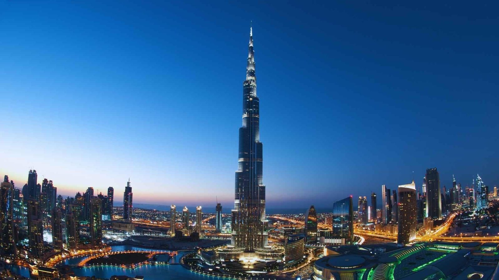Burj Khalifa illuminated above the Downtown Dubai skyline.