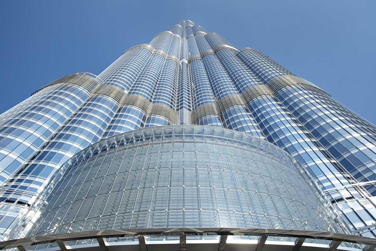Burj Khalifa viewed from below against the Dubai sky.
