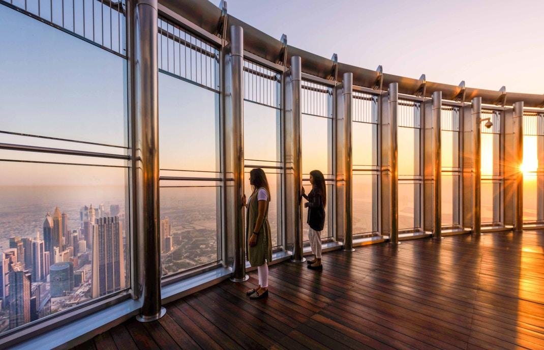 Dubai skyline viewed from Burj Khalifa around sunset.