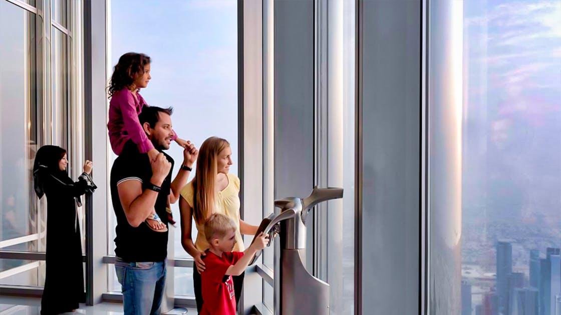 Family visiting a Burj Khalifa observation area.