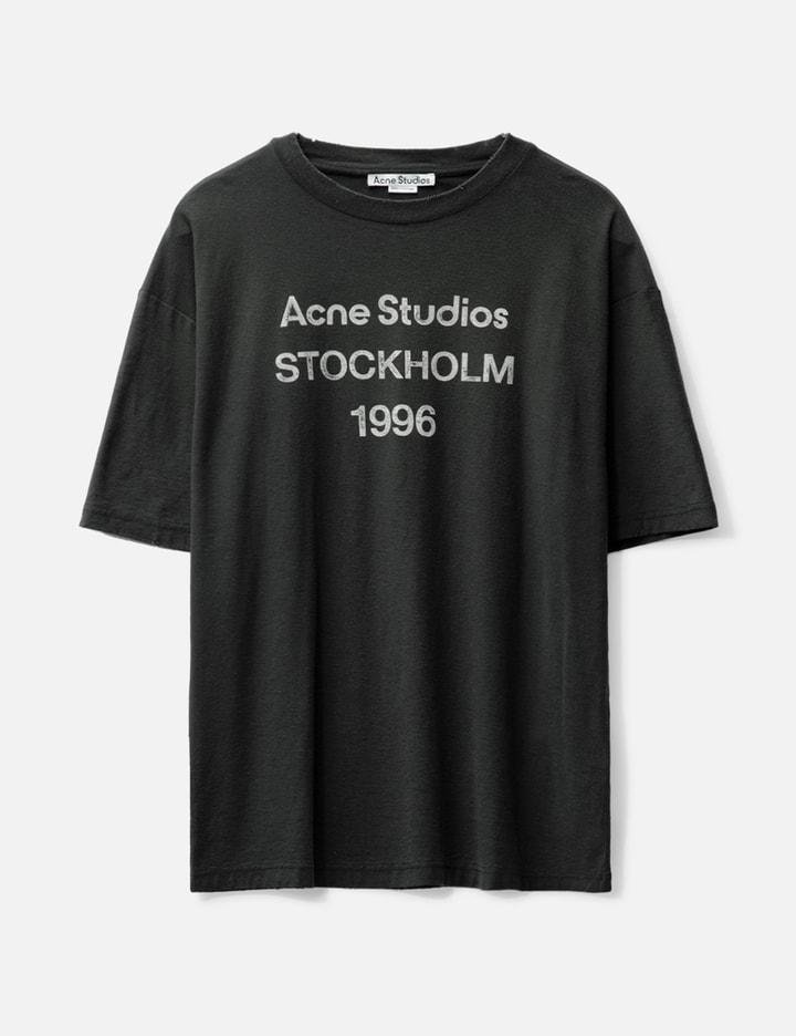 Faded-black Acne Studios Stockholm 1996 shirt in a minimalist studio.