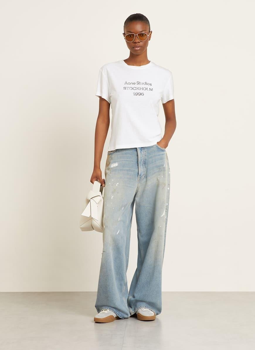 Acne Studios Stockholm logo shirt styled for everyday wear.