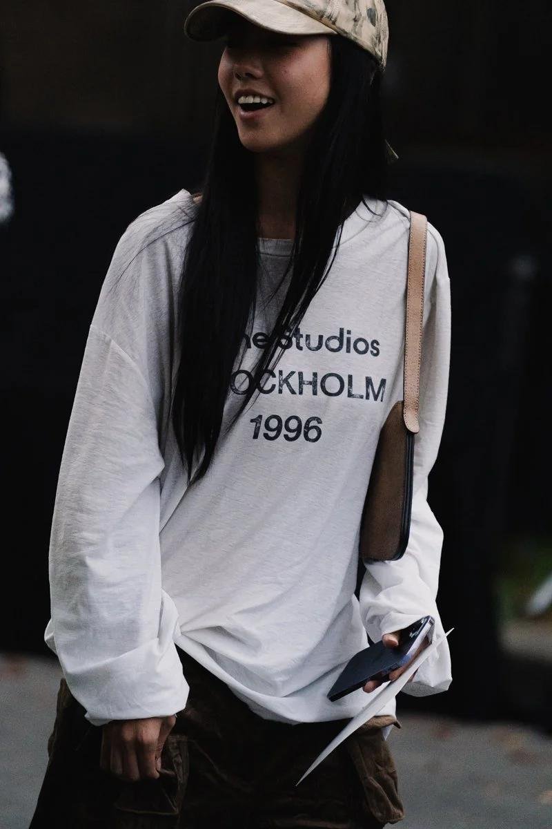Model wearing an Acne Studios Stockholm shirt with relaxed separates.