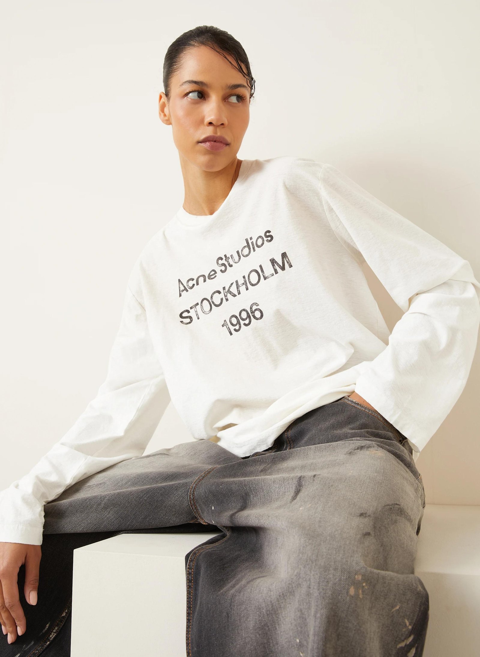Acne Studios Stockholm shirt showing its faded logo and distressed finish.