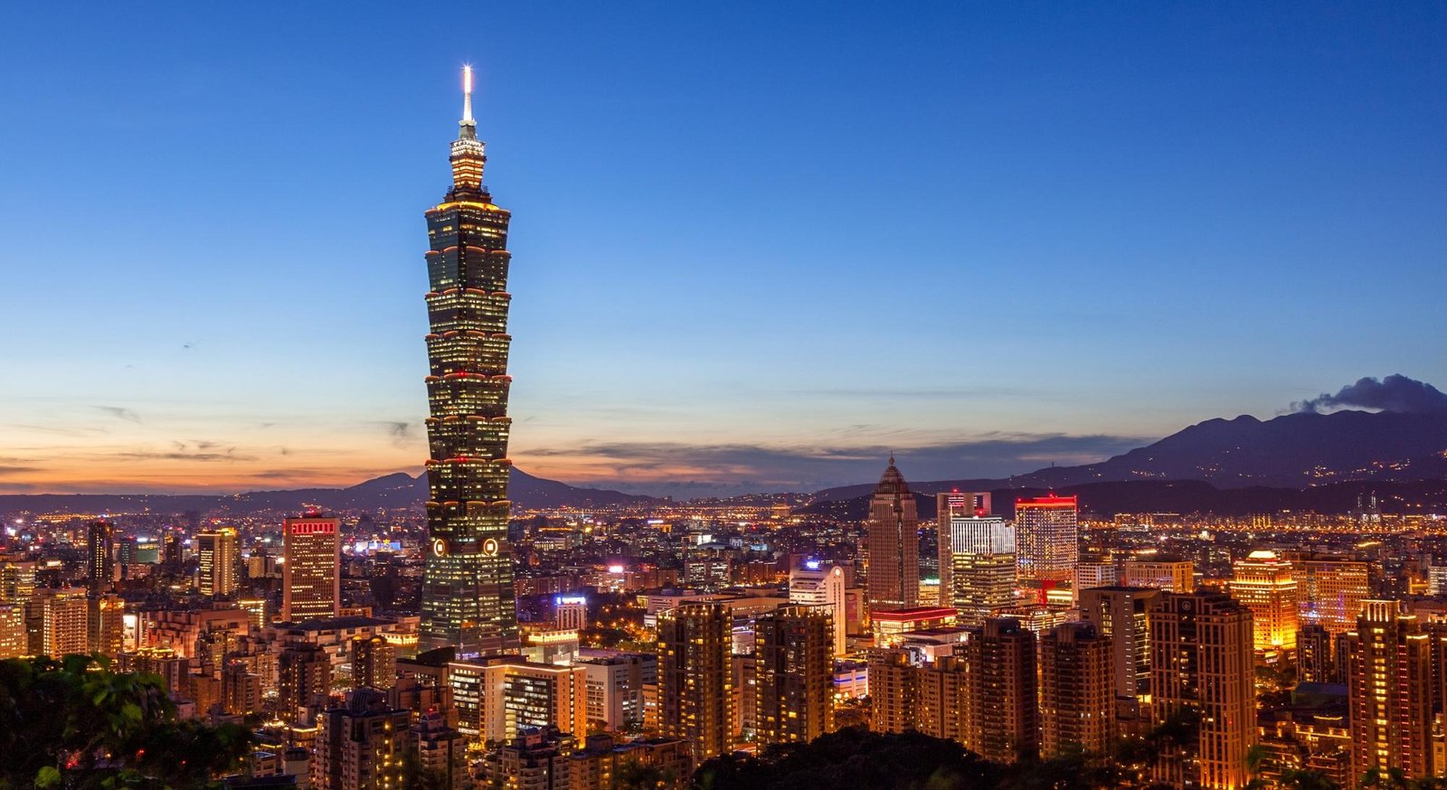 Taipei 101 rising above the modern Xinyi District skyline.