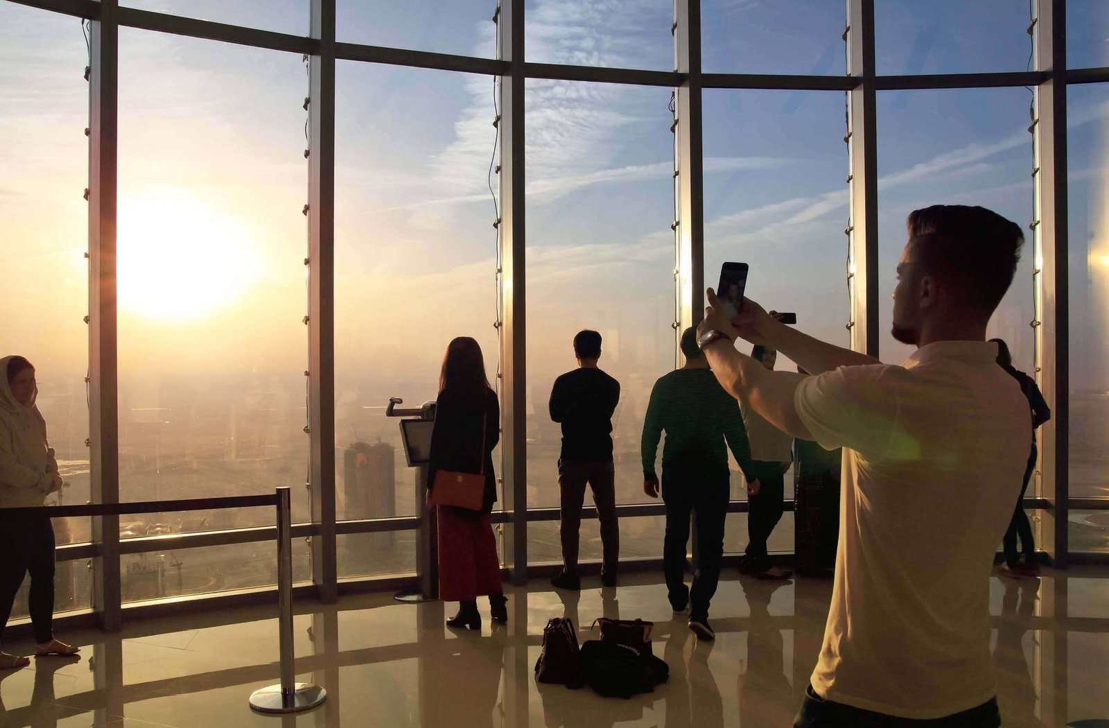 Visitors photographing the Taipei skyline from the observatory.