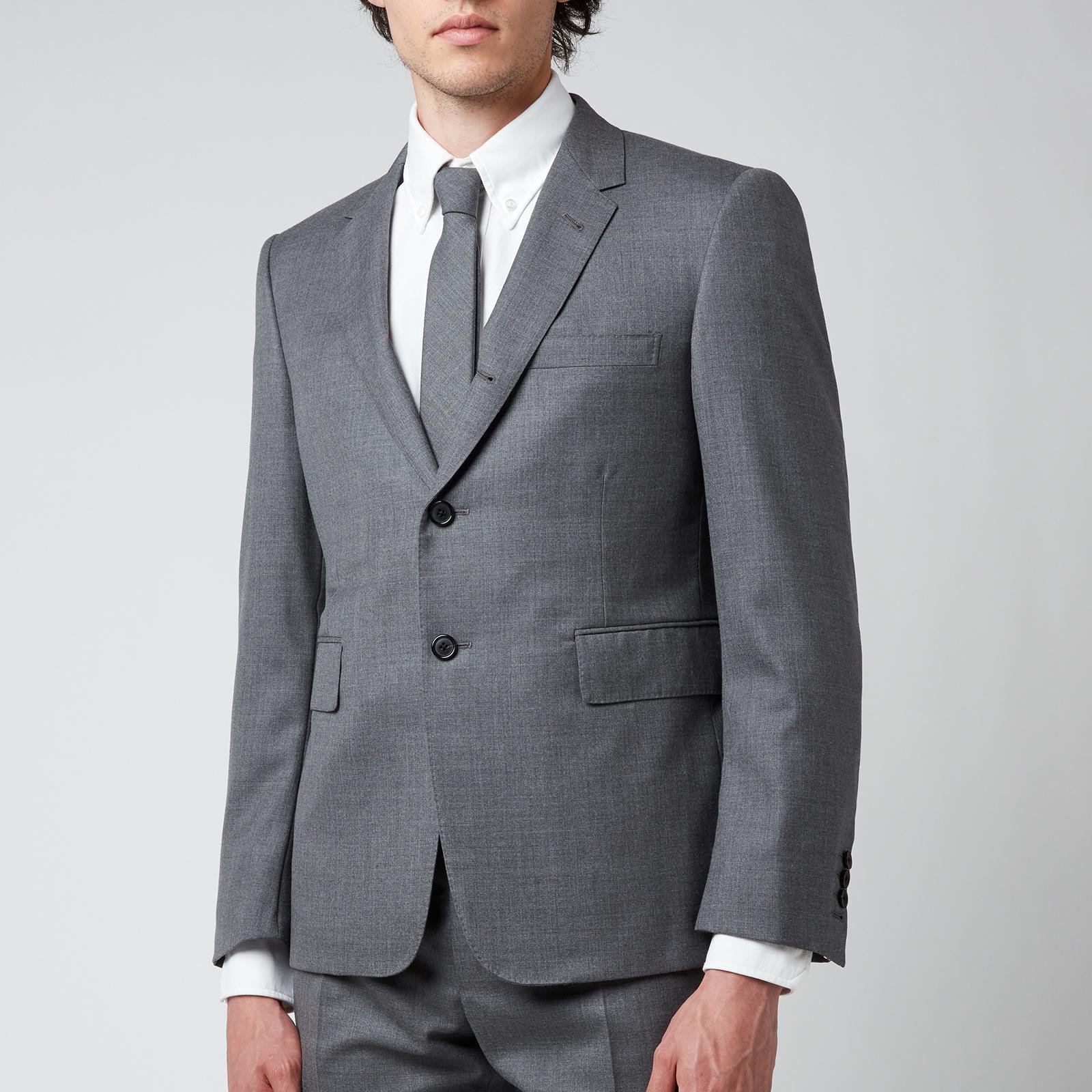 Close view of Thom Browne wool tailoring and construction details.