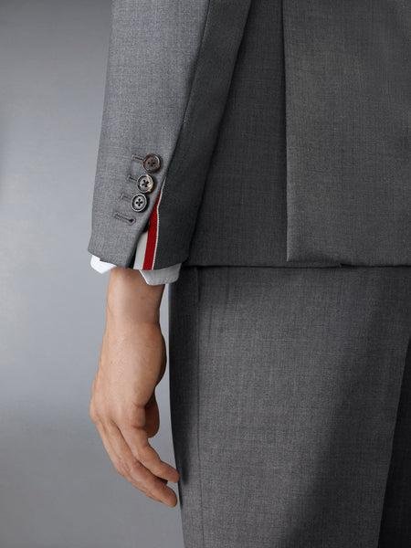 Model demonstrating the proportions of a Thom Browne tailored suit.