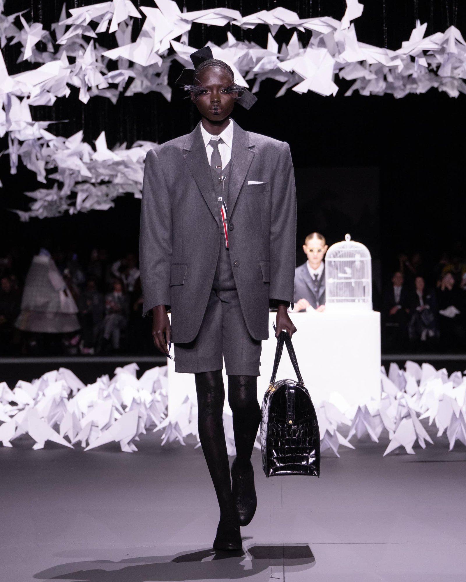 Selection of Thom Browne tailoring illustrating different suit choices.